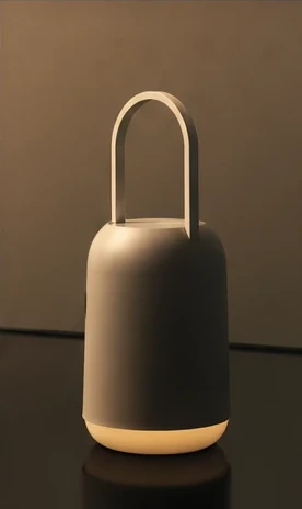 A portable lamp with a rounded body and slender carrying handle, glowing in the dark.